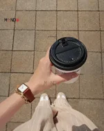 ساعت دنیل ولینگتون مدل DW00100696 طلایی با بند قهوه ای روی دست